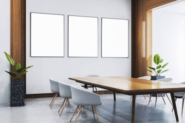 Duvarında üç tane boş dikey çerçeve olan çağdaş ofis odası, asgari tasarım, ahşap mobilya, beton zemin, iş yeri. 3B Hazırlama