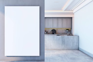 Modern mutfağın yanındaki gri duvarda boş tuval modeli var. Beton tezgah, gri dolap ve temiz iç mekan. 3B Hazırlama