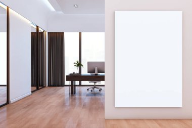 Modern ofis içinde duvarda boş tuval modeli sergileniyor. Ahşap zemin, büyük pencereler ve arka planda bilgisayar masası var. 3B Hazırlama