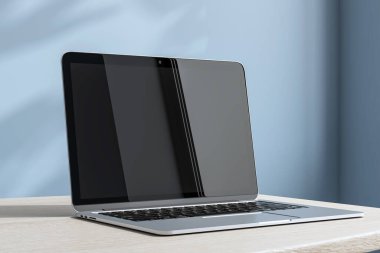 Masasında boş ekranı olan modern bir laptop, gerçekçi 3D görüntüleme tarzı, mavi duvar arkaplanı. Çalışma alanı ve teknoloji kavramı