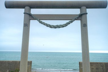 Kikonai, Oshima Subprefecture, Hokkaido, Japan - August 19, 2023 - Scene of Torii gate of Samegawa Shrine entrance to Misogihama Beach