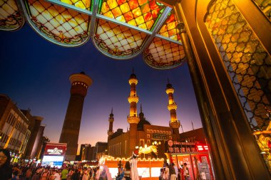 Urumqi, Xinjiang, China - June 21, 2024 - Scene of International Grand Bazaar Xinjiang, an Islamic bazaar, the largest bazaar in the world, combining Islamic culture, architecture, ethnic commerce and tourism clipart