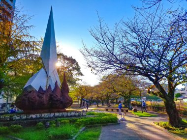 Kagoshima, Kyushu, Japan - November 18, 2024 - Cityscape of Central Kagoshima with many Japanese historic statue on side streets clipart