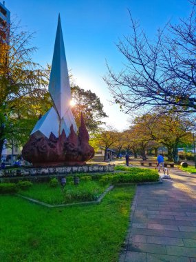 Kagoshima, Kyushu, Japan - November 18, 2024 - Cityscape of Central Kagoshima with many Japanese historic statue on side streets clipart