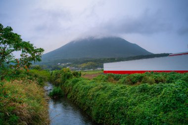 Kaimondake, or Mount Kaimon, a volcano located near the city of Ibusuki in the south of Kagoshima, called to the Fuji of Satsuma as its shape, Kagoshima, Kyushu, Japan clipart