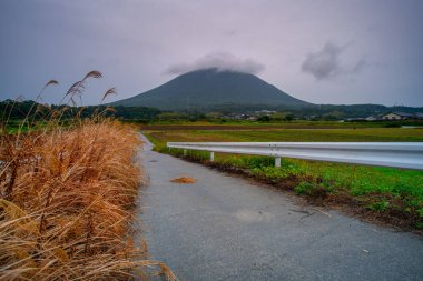 Kaimondake, or Mount Kaimon, a volcano located near the city of Ibusuki in the south of Kagoshima, called to the Fuji of Satsuma as its shape, Kagoshima, Kyushu, Japan clipart