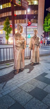 Kagoshima, Kyushu, Japan - November 18, 2024 - Cityscape of Central Kagoshima with many Japanese historic statue on side streets clipart