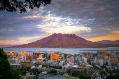 Sakurajima, an active stratovolcano, viewed from Shiroyama observation deck with Kagoshima city in Kyushu, Japan clipart