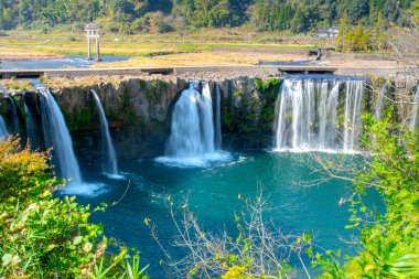 Harajiri Waterfall on Ono River in Ogata Town, referred to as Niagara Falls of East by appearance formed from pyroclastic flows of Mount Aso eruption, Bungo-Ono, Oita, Kyushu, Japan clipart