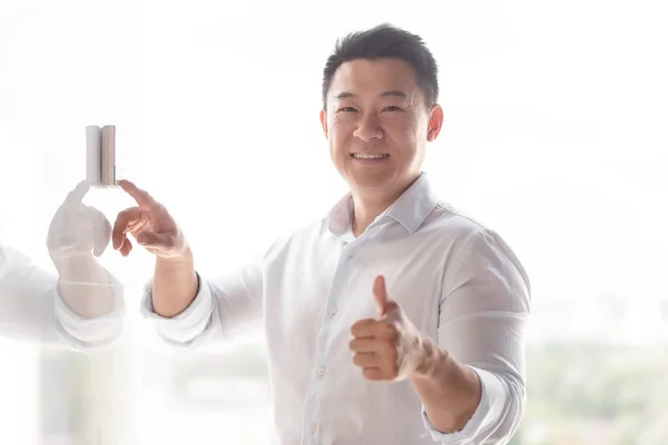 Portrait Smiling Asian Man Stands Wall Building Presses Incoming Call — Stock Photo, Image