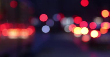 Bokeh of street evening lights, night city with car lights.