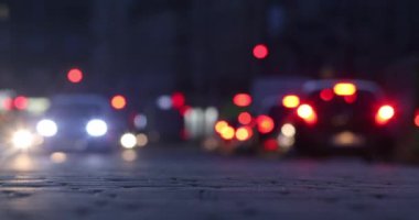 Bokeh of street evening lights, night city with car lights.