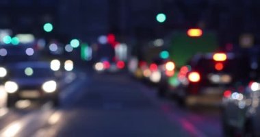 Bokeh of street evening lights, night city with car lights.