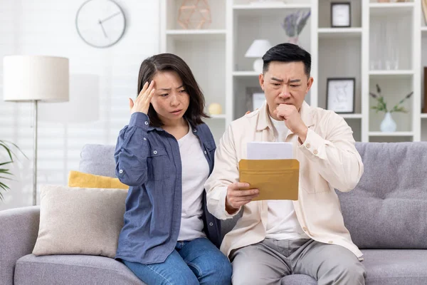 Upset Asian Family Man Woman Sitting Together Home Living Room — Stock Photo, Image