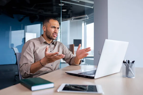 stock image Upset frustrated businessman looking at laptop window, man received online notification message with bad achievement results, workplace error.