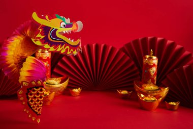 Chinese lion dance for Chinese new year with red fan in the background. High quality photo