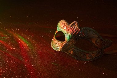 Masquerade Venitian, Mardi gras carnival mask on glitter background. High quality photo