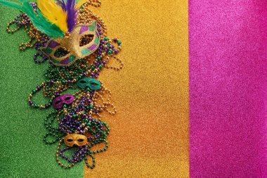 Mardi gras, Venetian or Carnivale mask on on a tricolor shining background. High quality photo