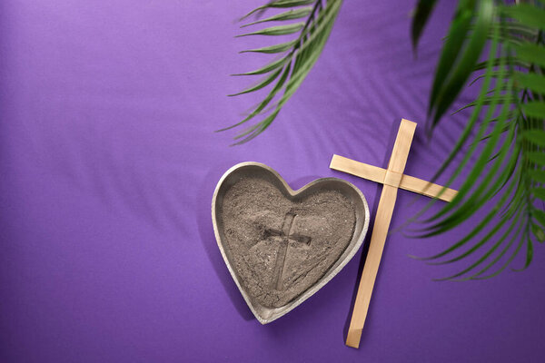 Ash Wednesday, Lent Season and Holy Week concept. Christian crosses and ashes on purple background