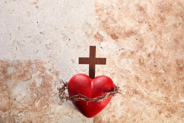 Sacred Heart of Jesus, surrounded by a crown of thorns and with wooden cross.