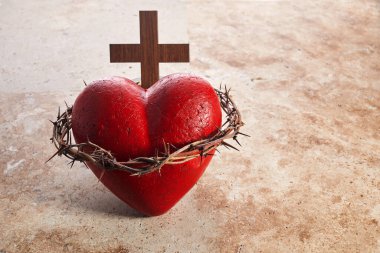 Sacred Heart of Jesus, surrounded by a crown of thorns and with wooden cross.