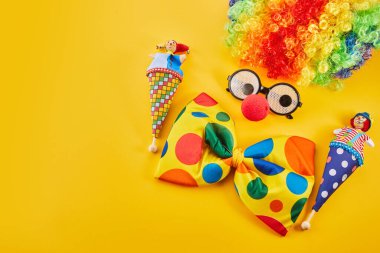 April Fools day concept. Clown on yellow background.