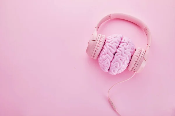Music brain and musical therapy. Human brain with headphones.