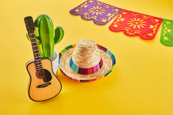 stock image Cinco de Mayo holiday background. Cactus, guitar and hat on yellow background