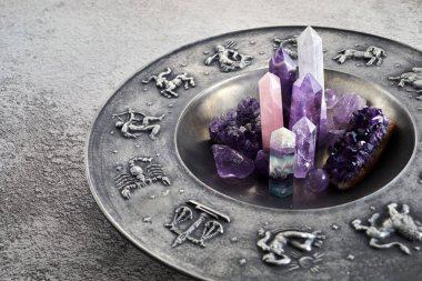 Crystals for healing, fortune telling and astrologhy circle on grey background. Esoteric and life coaching concept clipart