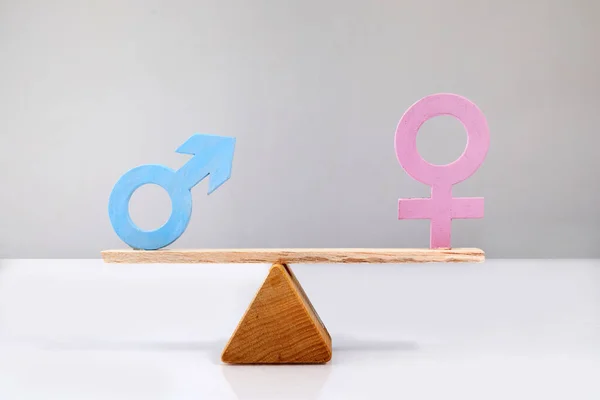 Gender equality concept. Male and female symbol on the scales with balance.