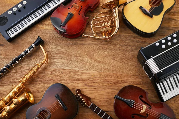 Frame Van Verschillende Muziekinstrumenten Houten Ondergrond — Stockfoto
