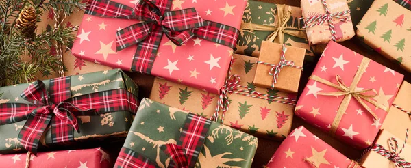 Boxing Day Concept. Different kinds of gift boxes on wooden background.