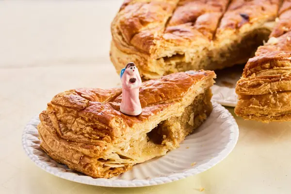 Epiphany cake on wooden table. Galette des rois traditional Epiphany cake in France.