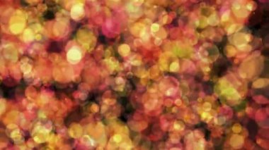 Renkli bulanık noktalar bokeh. Karanlık arka planda bulanık noktalar var. 4k soyut arkaplan. Kusursuz döngü.