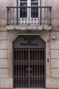 Facade with closed metal doors of the Bank of Portugal in Lisbon