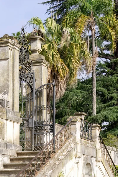 Ancient gate in the botanical garden of the University of Coimbra, Portugal