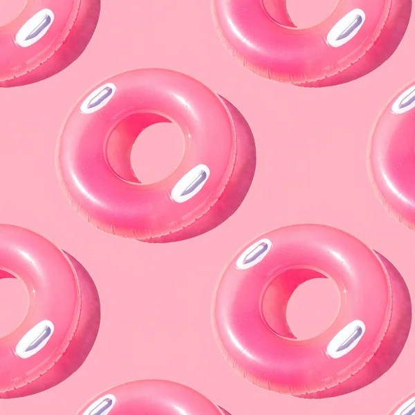 Pattern of small bright pink inflatable rubber circles on a pale pink background