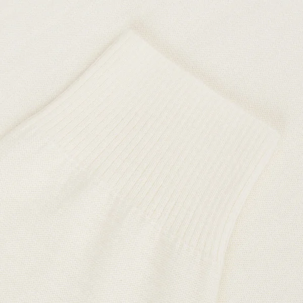 乳白色羊毛衫袖子近身背景 — 图库照片