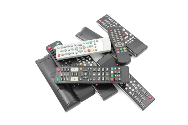 Tv remote controller sets and collection, many tv controllers, isolated white background, tv remote stack