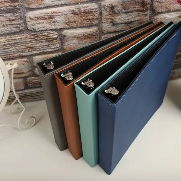 Personalized binding, leather folder cover, leather binding, binder, binder, office binding, corporate gift. Concept shot leather binding, top view, colorful
