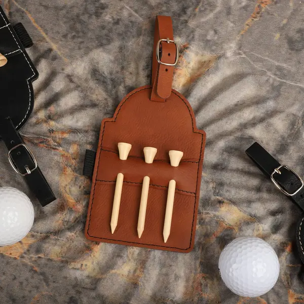 Colorful leather Golf Tee Holder. Concept shot, top view, different color. Golf tee. Golf ball.
