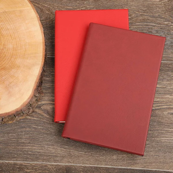 Leather Journals and Notebooks in different colors. Concept shot, top view. Custom background Journals and Notebooks view. Leather Sketchbook. Space Blank for text