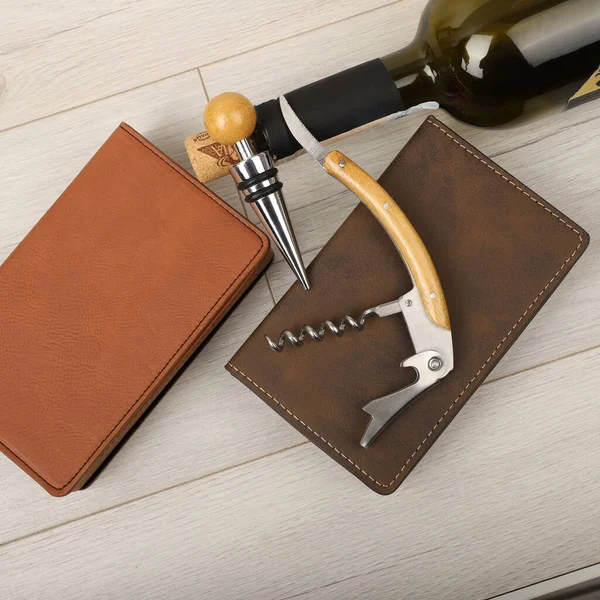 Wine opener set in leather box. Colorful leather boxes. Wine opener and cork. Close-up, top view, no people. Concept shot.