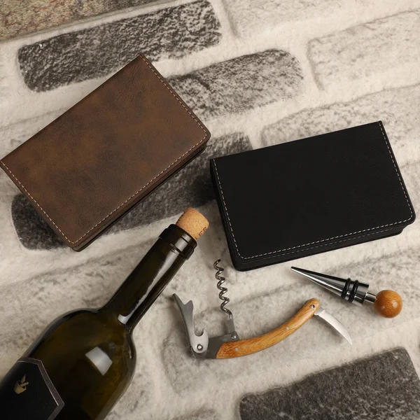 Wine opener set in leather box. Colorful leather boxes. Wine opener and cork. Close-up, top view, no people. Concept shot.