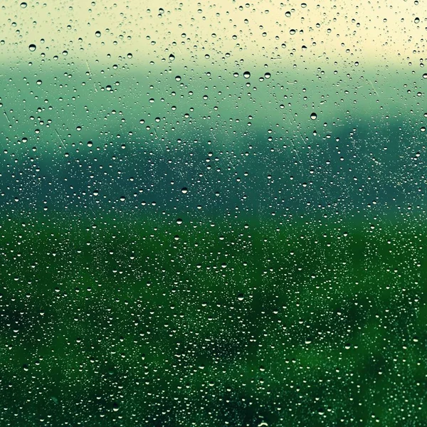 Krople Okno Krajobrazem Naturalnym Tle Koloru Koncepcja Deszcz Złą Pogodę — Zdjęcie stockowe