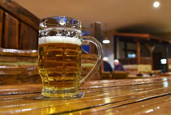 beer mug on the background of a bar in the evening