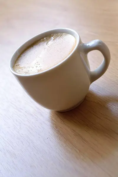 Kaffeetasse Auf Holzschreibtisch Draufsicht — Stockfoto
