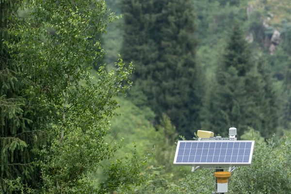 Solar panel with sensors in a forest area.