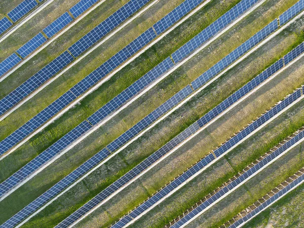 stock image Rows of solar panels at the station. View from the drone