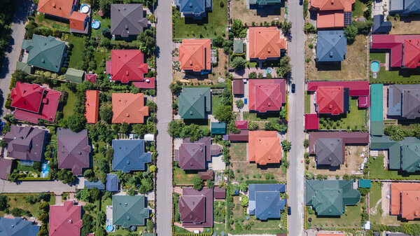Roofs of houses in a cottage town. View from a drone